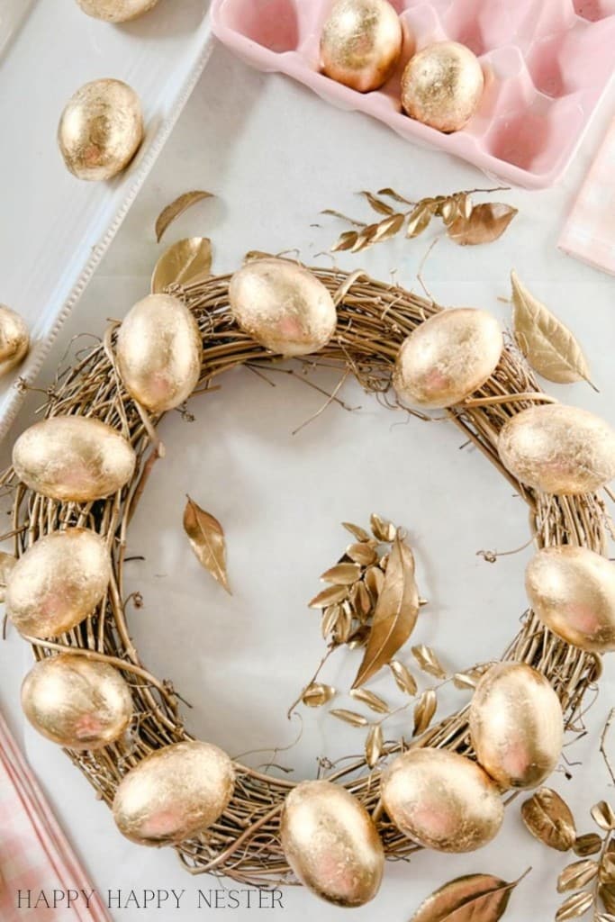 How to make an easter wreath with attaching gold leaf eggs to a grapevine wreath