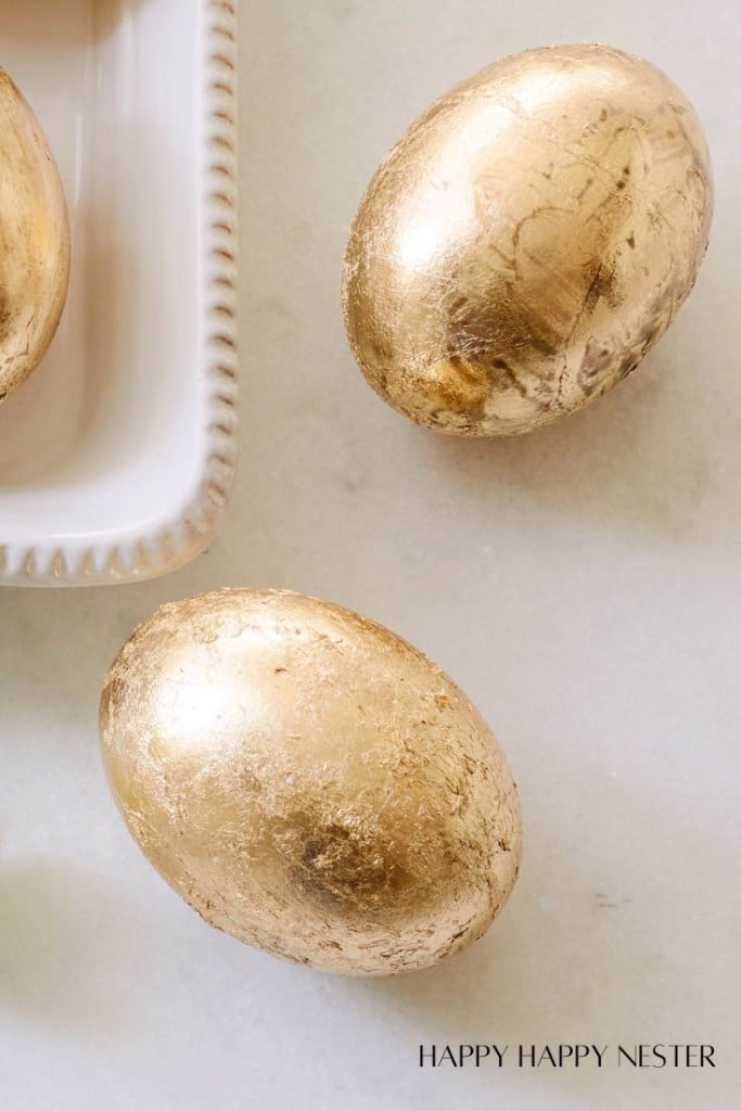 upclose photo of three gold leaf easter eggs