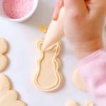 outlining and piping bunny cookies with icing