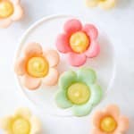 a few tarts on a little white cakestand. The other tarts are below it and blurred out
