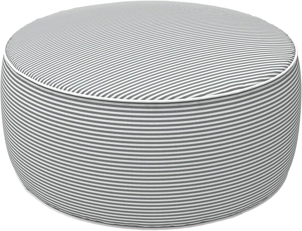 A round, low ottoman with a gray and white horizontal striped fabric cover, perfect for simple porch decor, viewed from an angle against a white background—an inviting accent easily found on Amazon.