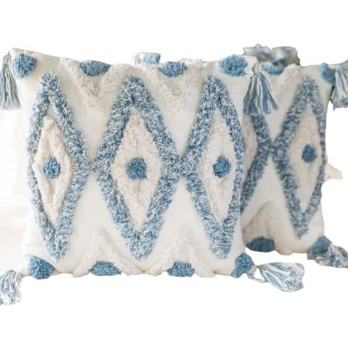 Two decorative square pillows with a textured diamond pattern in blue and white, featuring tasseled corners and a soft, bohemian style—perfect as amazon boho throw pillows to elevate your living space.