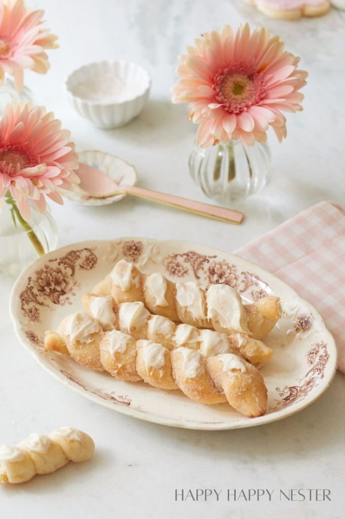 twisted cinnamon sugar breadsticks on an antique brown plate