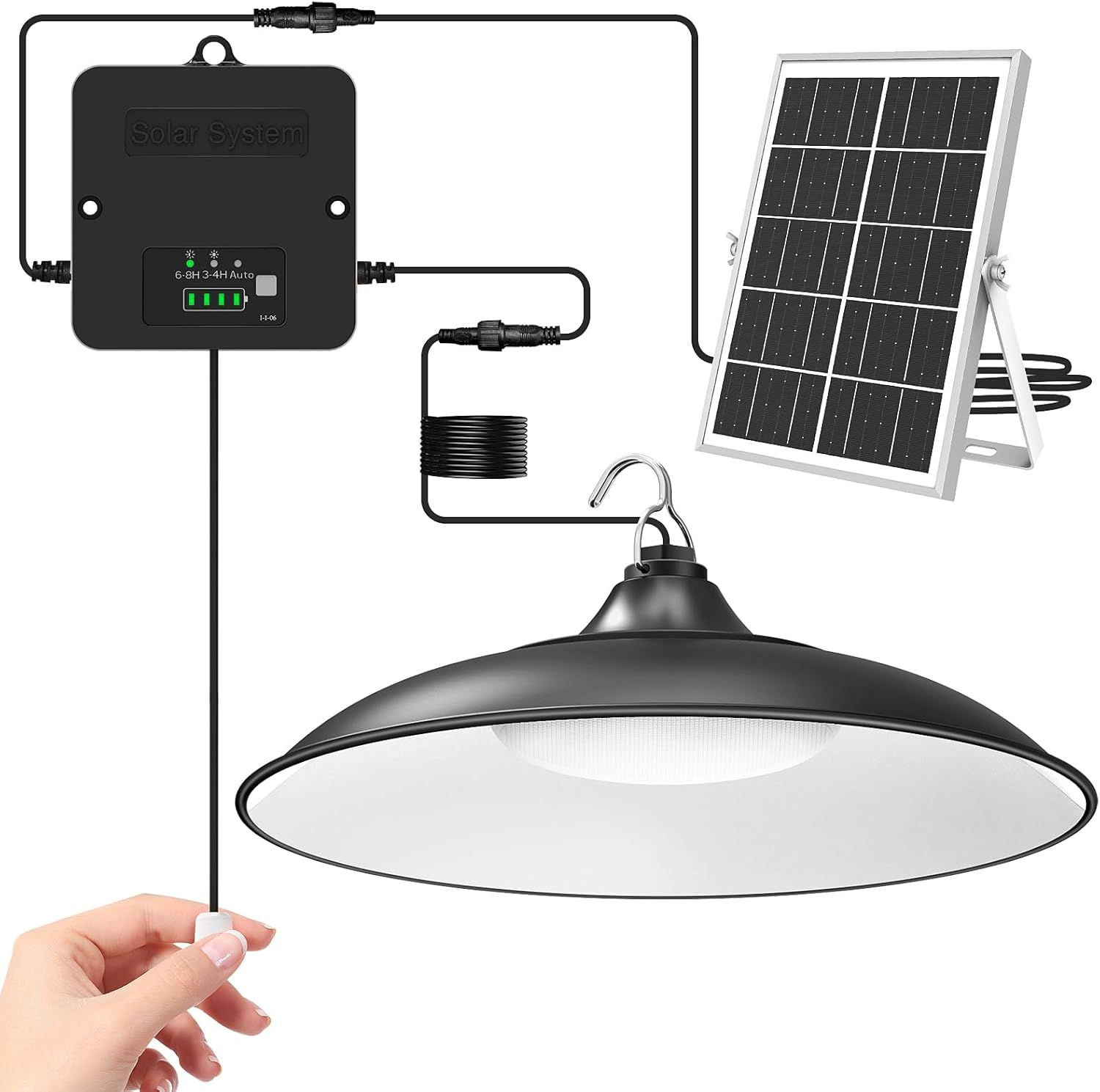 A hand pulls a cord to turn on a black hanging lamp connected by wires to a solar panel and a control box labeled "Solar System." Perfect as amazon unique solar garden decor, the panel is propped up on a stand.