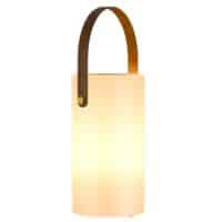A modern, cylindrical lantern with a warm, diffused glow and a brown leather handle attached to the top—this amazon unique solar garden decor is designed for easy carrying and adds a charming touch to any outdoor space.