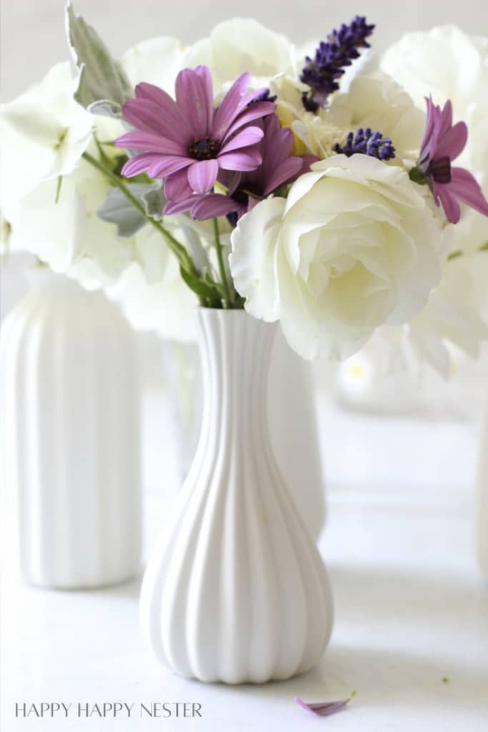 purple flowers in a short vase flower arrangements