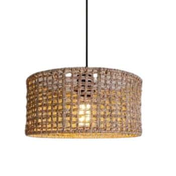 Rattan woven pendant light with a round, open-weave shade suspended from a black cord, illuminated warmly—an inspiring choice for modern rattan decor ideas against a white background.
