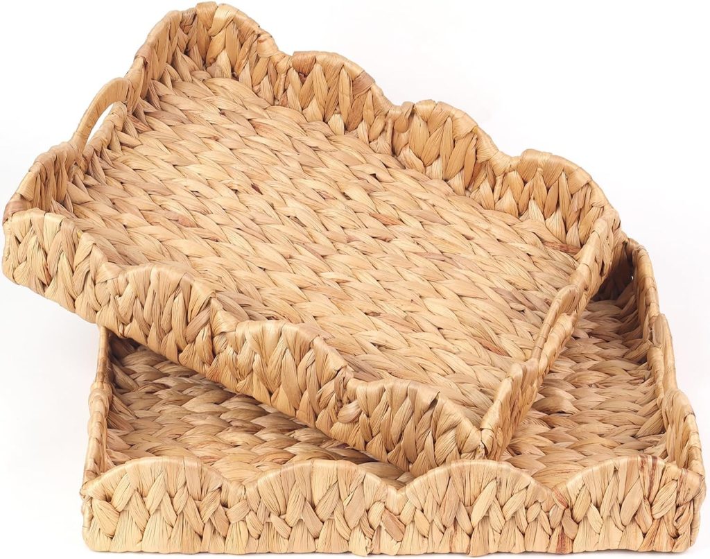 Two rectangular woven baskets with scalloped edges, stacked slightly askew. Made from natural light brown fibers, these pieces offer a rustic, textured look—perfect for adding charm to your space and inspiring rattan decor ideas.