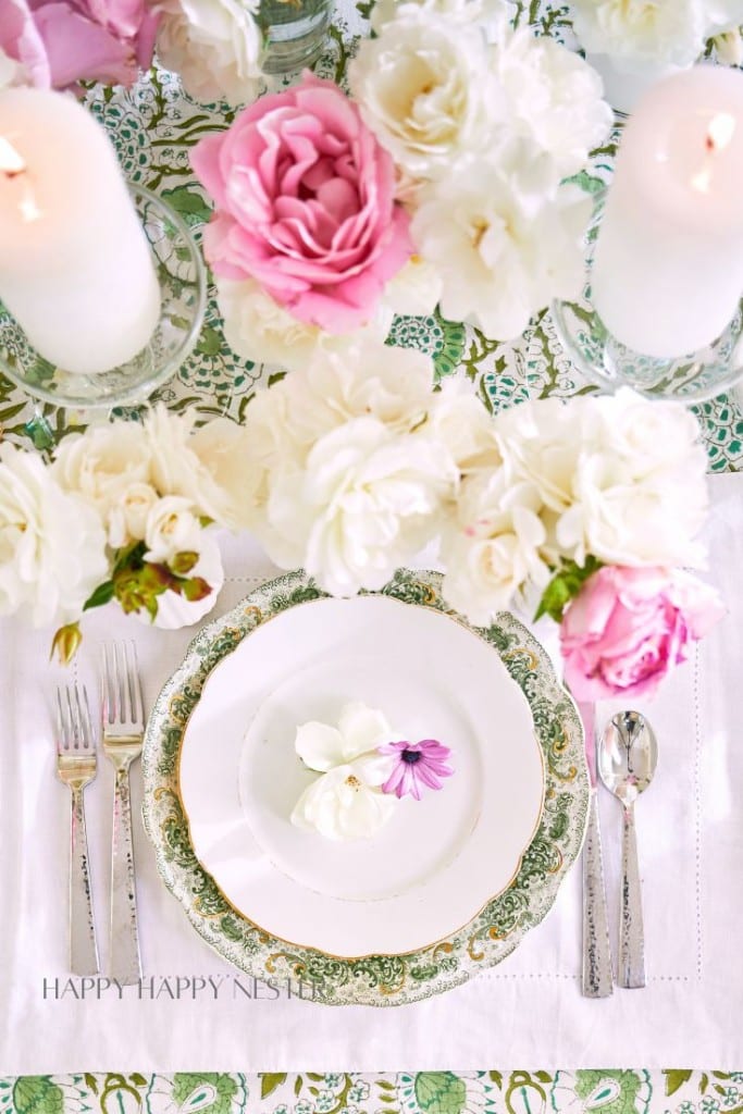 short vase flower arrangements on a beautiful green table setting