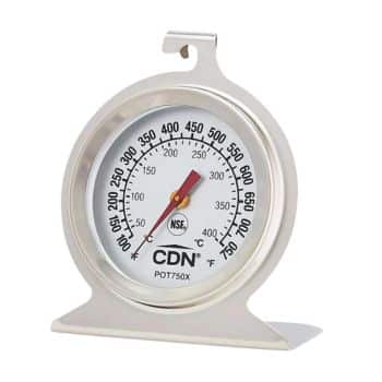 A round, silver-colored oven thermometer with a hook on top and a sturdy base. The dial displays temperature ranges from 150°F to 550°F and 70°C to 280°C, with the needle pointing around 325°F/160°C. The brand name "CDN" is printed on the front.