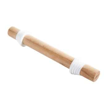 A wooden rolling pin with adjustable thickness rings on both ends. The rings are white and help to maintain a consistent dough thickness.