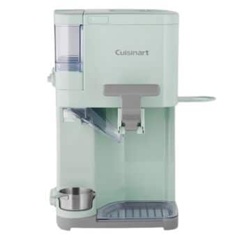A mint green Cuisinart single-serve coffee maker with a built-in water reservoir, stainless steel cup holder, and a drip tray underneath. The sleek and modern design includes a coffee pod compartment and a side platform for accessories.