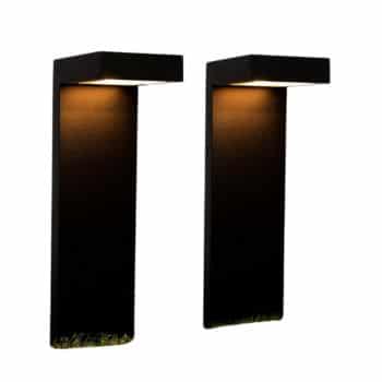 Two modern, rectangular, black outdoor wall lights mounted on a flat vertical surface. The lights emit a warm glow downward, illuminating the area below. Their minimalist design creates a sleek and contemporary appearance, making them perfect for enhancing flower garden decor ideas and more.