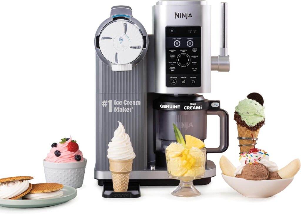 A Ninja ice cream maker surrounded by various desserts, including ice cream cones, a sundae, a bowl of ice cream with cookies, and a glass of soft serve ice cream with fruit toppings, showcases the versatility of essential ice cream tools for creating delicious treats.