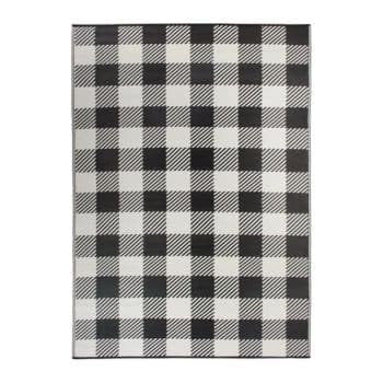 A rectangular rug featuring a black and white checkered pattern. The design consists of alternating squares in a classic buffalo plaid style, with some squares having diagonal lines. The rug has a simple, monochromatic color scheme.