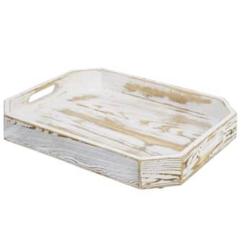 A rectangular rustic wooden tray with distressed white paint finish. The tray has raised edges with cut-out handles on each end, giving it a vintage and worn look. Suitable for serving food and drinks or as a decorative piece.