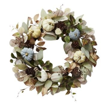 A decorative wreath made of assorted greenery, dried eucalyptus leaves, pine cones, and miniature pumpkins in shades of white, gray, and light blue. The arrangement gives a rustic and autumnal feel, suitable for seasonal or thanksgiving decor.