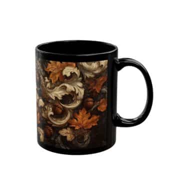 A black mug featuring an intricate design with autumn leaves, acorns, and swirling patterns in shades of brown, tan, and orange.