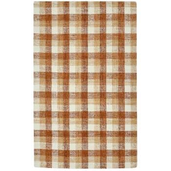 A rectangular rug featuring a plaid pattern with shades of brown, beige, and cream. The intersecting lines form a classic checkered design, adding a rustic and cozy feel to the textile.