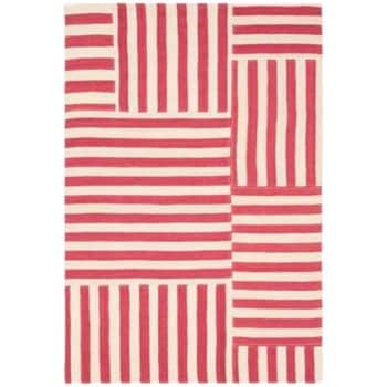 A rectangular area rug featuring a pattern of red and white vertical and horizontal stripes. The stripes are arranged in various rectangular and square sections, creating an asymmetrical, modern design.