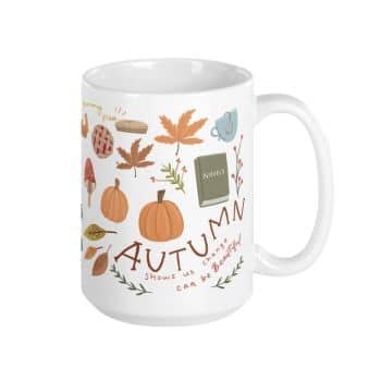 A white mug adorned with autumn-themed illustrations, including pumpkins, pie, mushrooms, leaves, and a book. The text on the mug reads, “Autumn shows us how beautiful change can be.” The design features warm colors like orange, red, and brown.