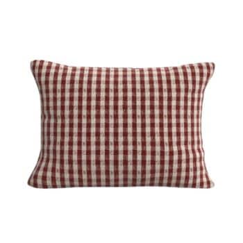 A rectangular pillow with a red and white checkered pattern, placed against a plain white background. The checkered design features evenly spaced squares, creating a classic and cozy look.