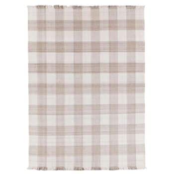 A rectangular rug featuring a plaid pattern in shades of beige and cream. The rug has fringed edges on the shorter sides, adding a touch of texture to its classic design.