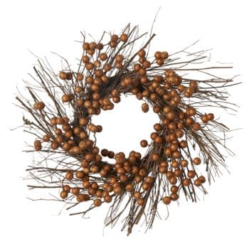 A decorative wreath made of small, round wooden berries and thin, intertwined twigs, arranged in a circular shape. The wreath has a rustic and natural look, suitable for autumn or winter decoration.