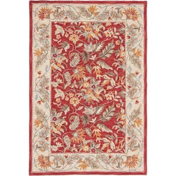 An ornate area rug features a central red field with a dense floral and leaf pattern in beige, ivory, and green tones. The border is cream-colored, decorated with similar floral motifs that complement the intricate central design.