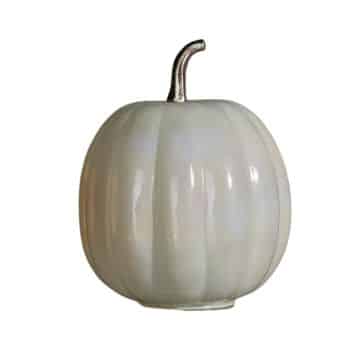 A decorative ceramic pumpkin with a smooth, glossy white finish and a metallic silver stem, standing on a plain background. The pumpkin has evenly spaced ridges and a rounded shape.