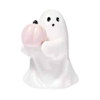 A ceramic ghost figurine is holding a pastel pink pumpkin. The ghost has a simple design with two black dot eyes and a small nose, standing against a white background.