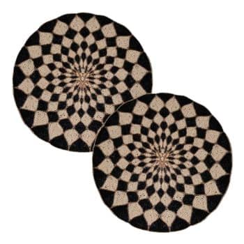 A pair of black and white patterned rugs.