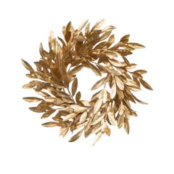 A gold-colored wreath made of metallic leaves arranged in a circular pattern. The leaves are shiny and have a slightly textured surface, giving the wreath an elegant and festive appearance. The background is plain white.