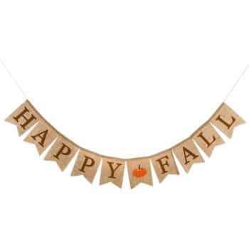 A burlap banner with triangular pennants strung together. The pennants spell "HAPPY FALL" in bold, dark brown letters. There is a small orange pumpkin image between the words "HAPPY" and "FALL." This festive fall decor hangs on a white string.