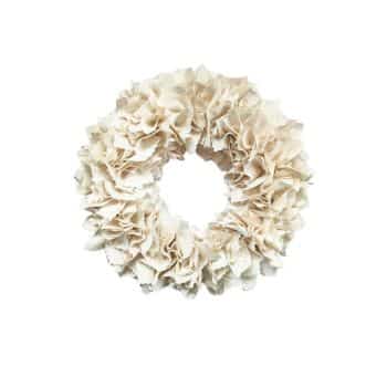 A decorative wreath made of beige, ruffled fabric. The fabric is arranged in a way that creates a textured, fluffy appearance. The wreath is circular and placed against a plain white background.