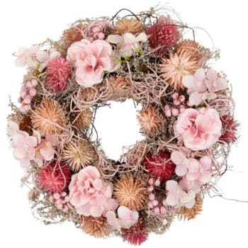 A beautiful floral wreath featuring a mix of blush pink and muted red flowers, delicate hydrangeas, and dried foliage. The wreath has a rustic charm with a variety of textures and soft colors, ideal for a decorative touch in any season.