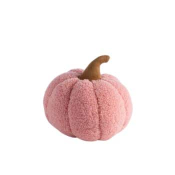 A small, plush pumpkin with a soft, textured surface. The body of the pumpkin is light pink, and it has a short, brown stem on top. The pumpkin features plump, segmented sections, resembling a classic pumpkin shape. The background is white.