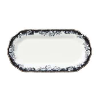 A rectangular serving platter with rounded corners, featuring a white center and an intricate black and white floral pattern along the scalloped edges. The outer border includes a gold beaded trim, giving it an elegant and vintage look.