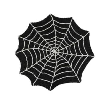 A black, circular mat designed to resemble a spider web with white threads forming the web pattern.