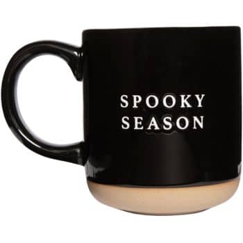 A black mug with a beige bottom and the words "SPOOKY SEASON" printed in white text on the front.