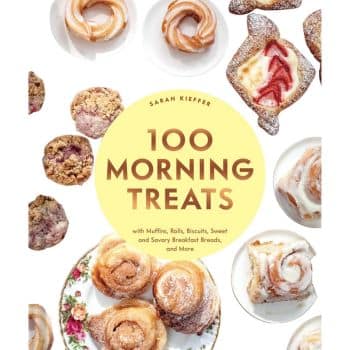 The cover of a cookbook titled "100 Morning Treats" by Sarah Kieffer features an assortment of breakfast pastries, including muffins, rolls, biscuits, autumn cookies, and sweet and savory breads. Various pastries are displayed on plates surrounding the book's title in the center.