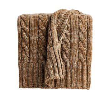 A folded, chunky knit scarf in a brown, cable-knit pattern. The scarf is made of thick yarn with alternating braided and ribbed textures, giving it a warm and cozy appearance.