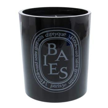 A black Diptyque candle with a glossy finish, featuring the label "Baies" in white text. The candle is cylindrical, showcasing the brand's iconic oval logo with the address "34 Boulevard Saint Germain Paris" around it.