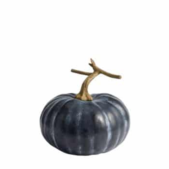 A decorative dark blue pumpkin with a brown stem against a plain white background.