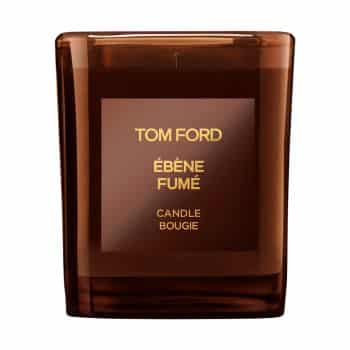 A square, brown glass candle with a label reading "Tom Ford Ébène Fumé, Candle Bougie" in gold lettering on the front.