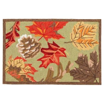 A rectangular doormat with a nature-themed design featuring autumn leaves in shades of red, orange, yellow, and brown, along with a pine cone. The background is a light green color, and it has a brown border.