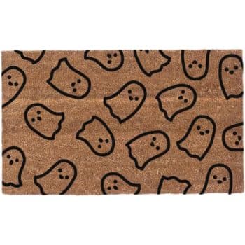 A rectangular doormat with a brown background and a pattern of black-outlined ghost faces in various orientations. The ghosts are depicted with two round eyes and a small round mouth, creating a cute and playful design.