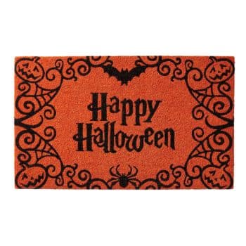 An orange doormat with black decorations featuring the text "Happy Halloween" in a spooky font. Surrounding the text are designs of bats, spider webs, pumpkins, and a spider at the bottom.