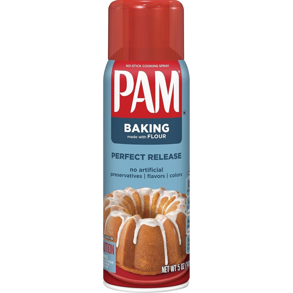 A can of PAM Baking Spray with Flour showcases a Bundt cake topped with icing, perfect for your fall dessert recipes. The spray promises no artificial preservatives, flavors, or colors.