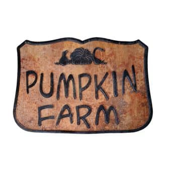 A rustic metal sign with "Pumpkin Farm" in bold black letters, featuring a pumpkin and vine illustration at the top, against a weathered brown background—perfect front door decor for fall.